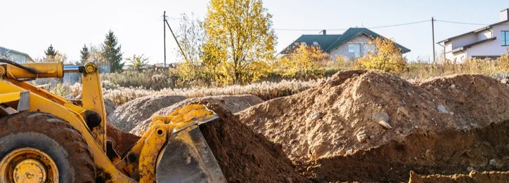 Bulldozers digging up a lot