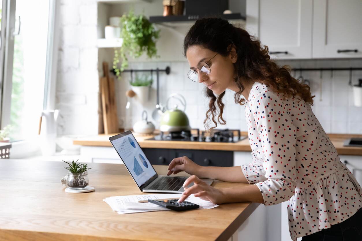 Woman using a calculator to do her finances